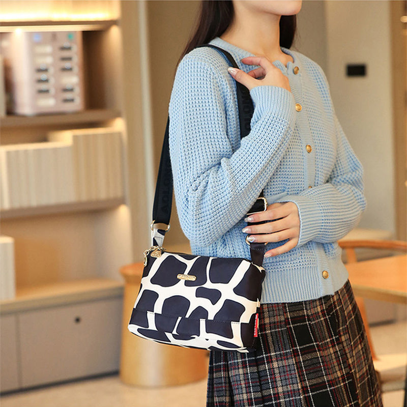 Sac à bandoulière chic en cuir avec multiples poches pour femme, design élégant et pratique