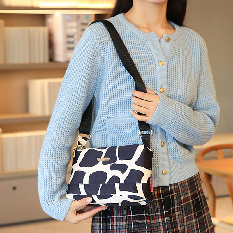 Sac à bandoulière chic en cuir avec multiples poches pour femme, design élégant et pratique