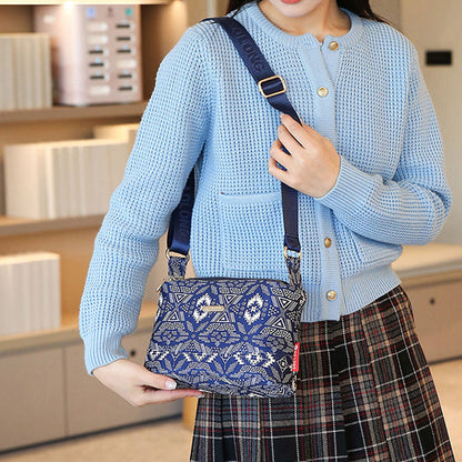 Sac à bandoulière chic en cuir avec multiples poches pour femme, design élégant et pratique