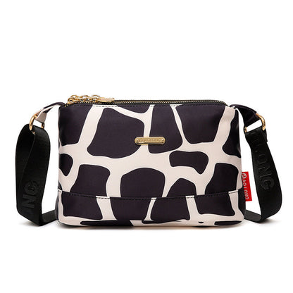 Sac à bandoulière chic en cuir avec multiples poches pour femme, design élégant et pratique